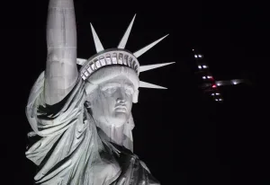 Prints of The Solar Impulse 2 aircraft flies over the Statue of Liberty before landing at JFK airport June 11, 2016 in New York USA Prints: Us-Aviation-Statue of Liberty-Solar Impulse