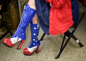 Prints of A delegate on the first day of the Republican National Convention on July 18, 2016 at the Quicken Loans Arena in Cleveland, Ohio. / AFP PHOTO / TIMOTHY A. CLARY USA Prints: Usa-Stars and Stripes - Boots