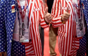 Prints of A delegate in patriotic dress on the first day of the Republican National Convention in Cleveland, Ohio. AFP PHOTO / TIMOTHY A. CLARY USA Prints: Usa-Stars and Stripes- Reflection