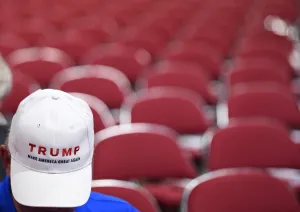 Prints of A delegate is seen on the first day of the Republican National Convention wearing a hat supporting Trump. AFP PHOTO / TIMOTHY A. CLARY USA Prints: Usa-Trump-Hat