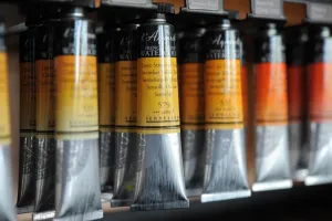 France Prints: A view of tubes of watercolor paint in a workshop at the Raphael-Isabey-Sennelier