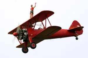 A wing-walker prerforms on a Boeing Stearman Pt13 during the WAG 2009 (World Air A wing-walker prerforms on a Boeing Stearman Pt13 during the WAG 2009 (World Air