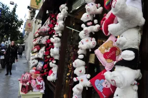 A woman walks past a shop selling love themed toys ahead of Valentine s