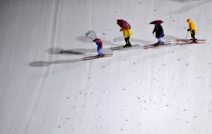 Workers prepare the slope of the Large Hill individual ski jumping in the World Ski Workers prepare the slope of the Large Hill individual ski jumping in the World Ski